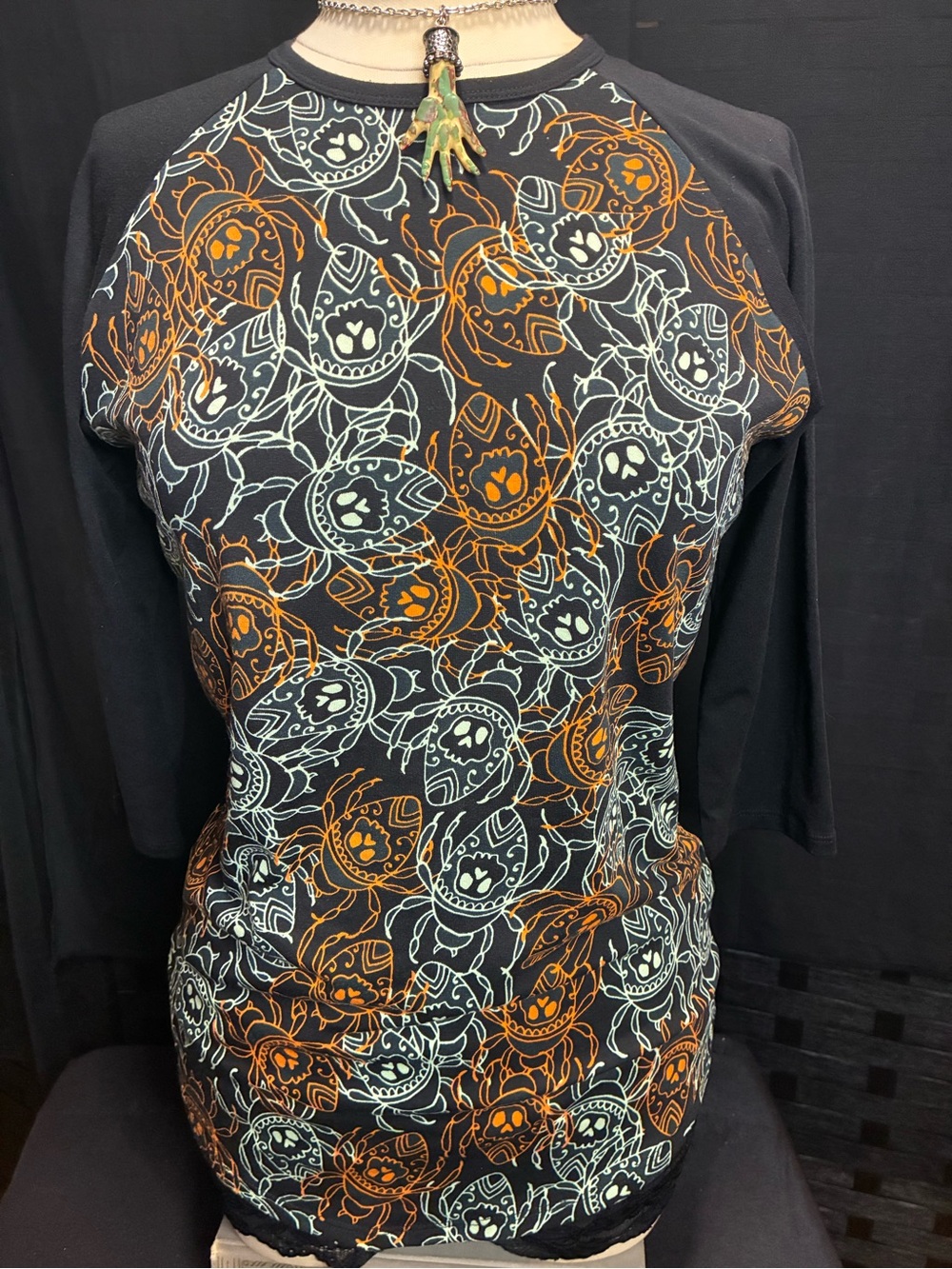 LuLaRoe Black Long Sleeve Tee with Orange and White Scarab Skull Print